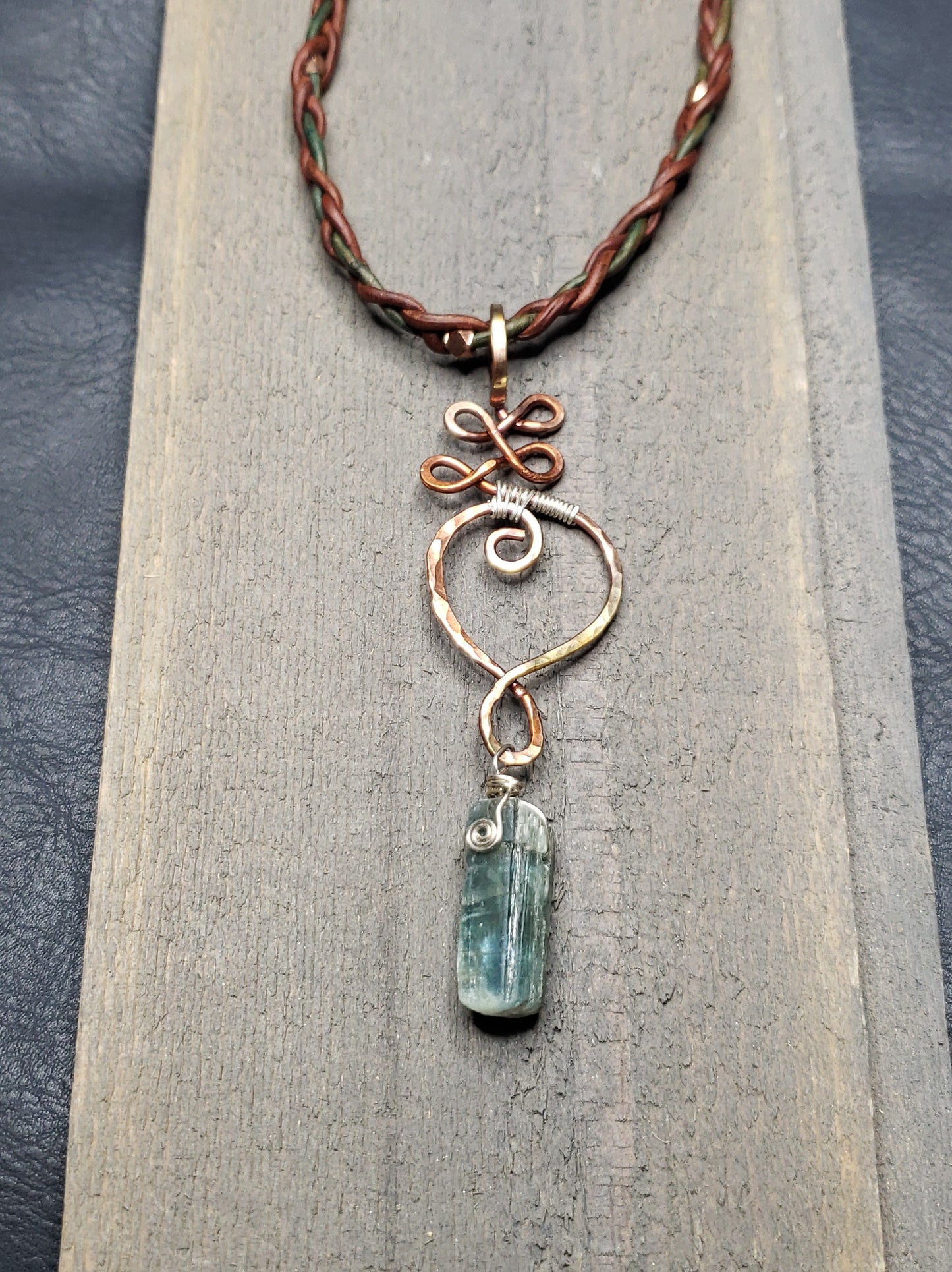 Copper Unalome pendant with kyanite