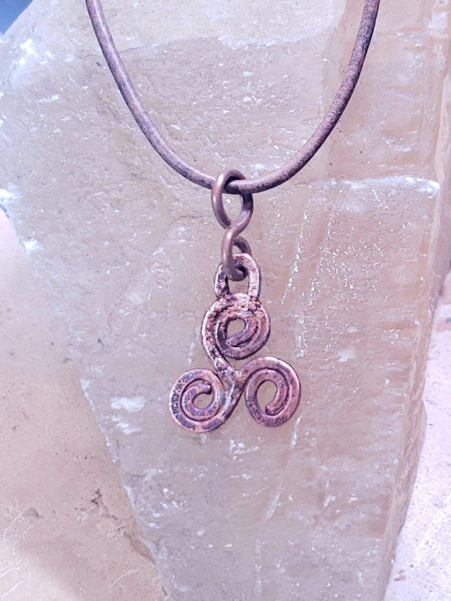 Rustic triskelle symbol