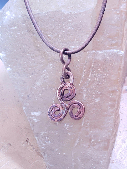 Rustic triskelle symbol