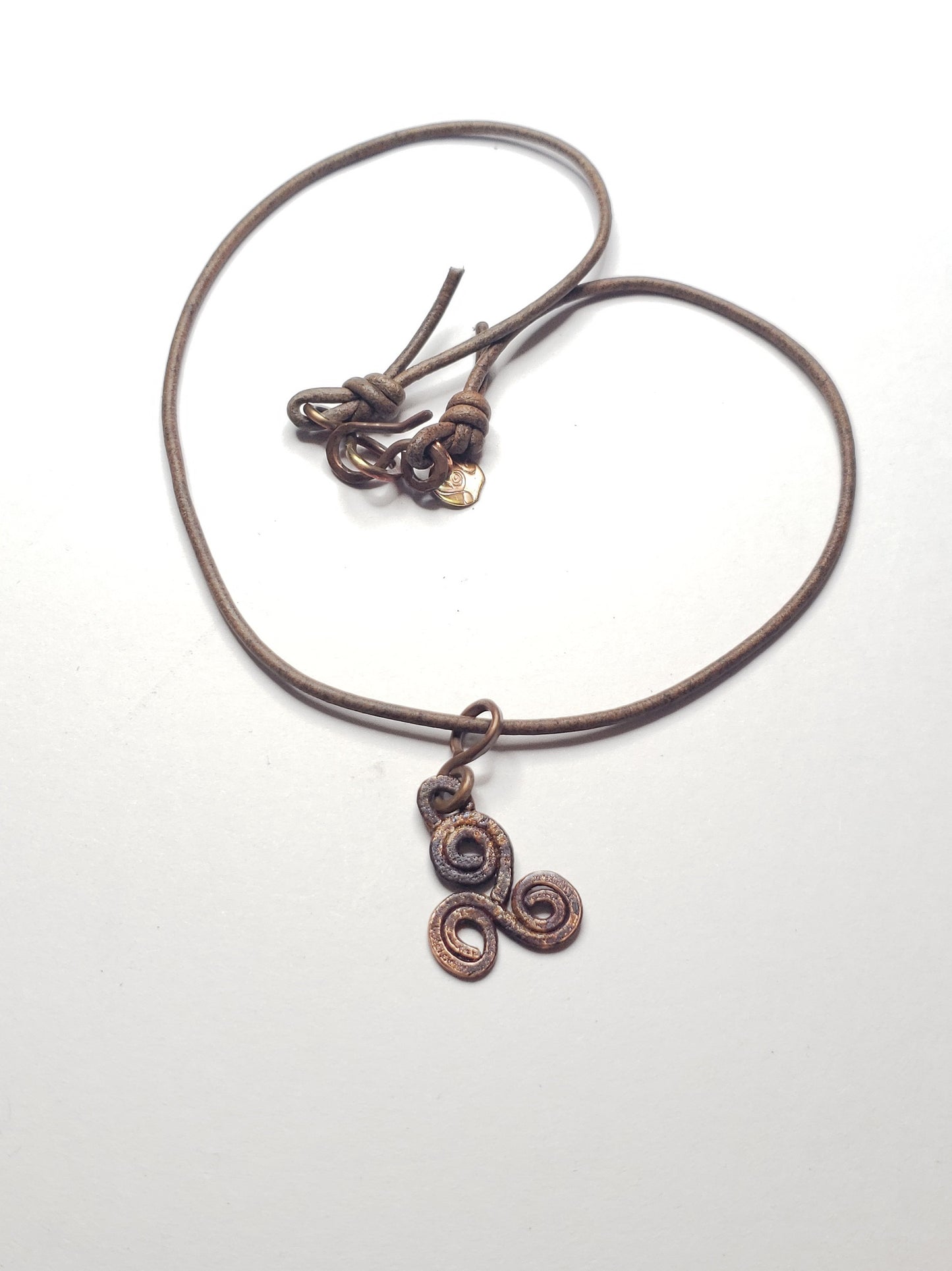 Rustic triskelle symbol