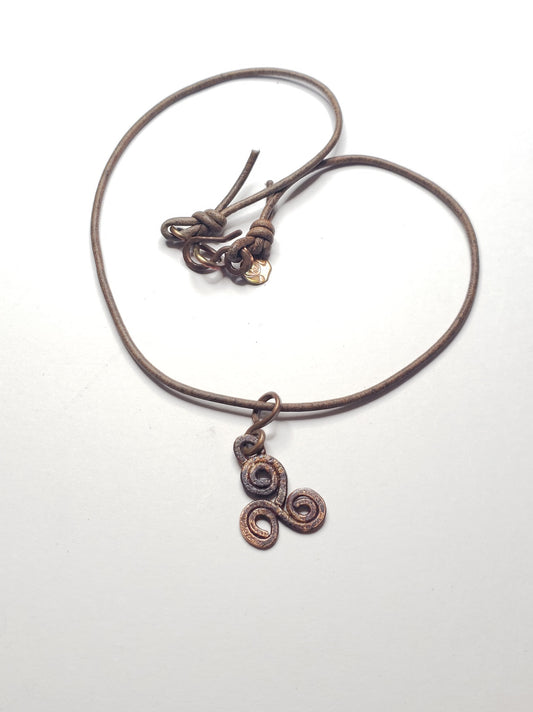 Rustic triskelle symbol