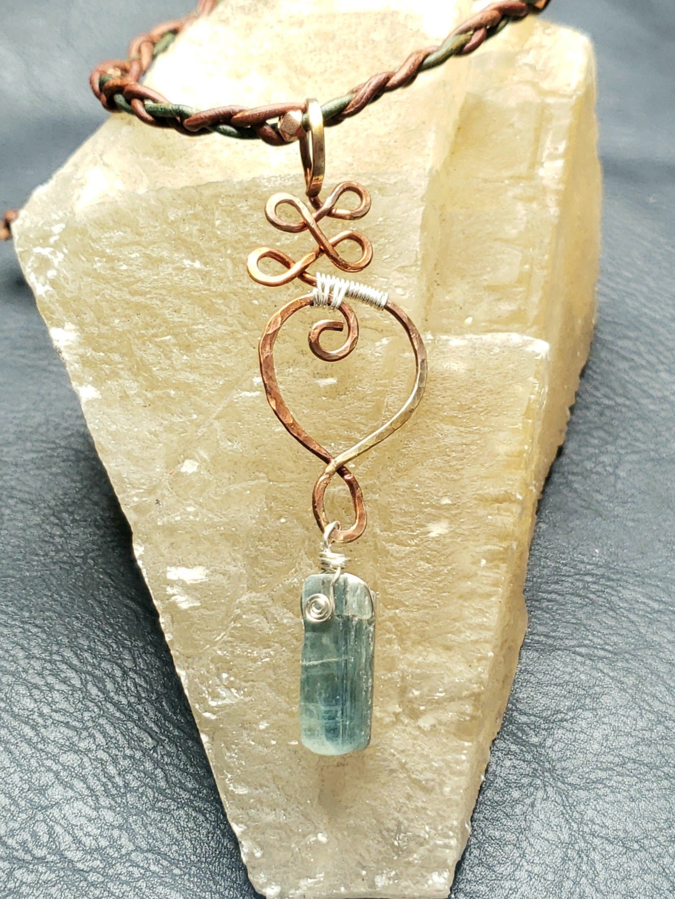 Copper Unalome pendant with kyanite